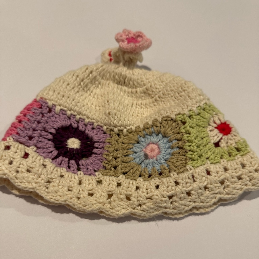 2H KNITS CROCHET HAT.  Cream with lovely pastel flower squares, 2 flower tassels